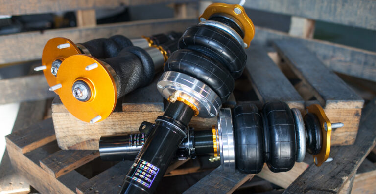 The Struts and bags kit laid out — struts, air bags, tank, compressor and management
